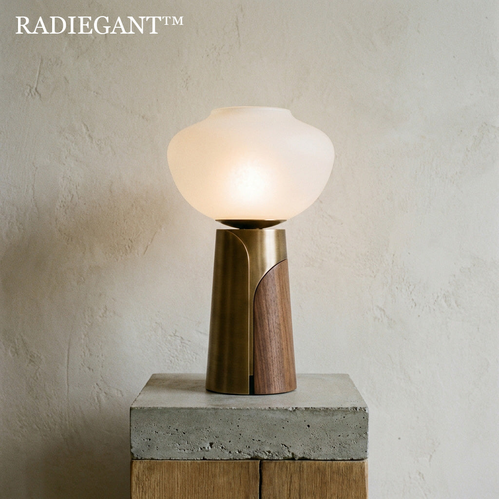 ◓Radiegant™ THE GEO-FOLD WOOD & BRASS LUMINARY "True warmth is not merely the color of the bulb; it is the texture of the vessel. A luminary forged to capture the earth's opposing forces—the cold permanence of brass and the living grain of timber."