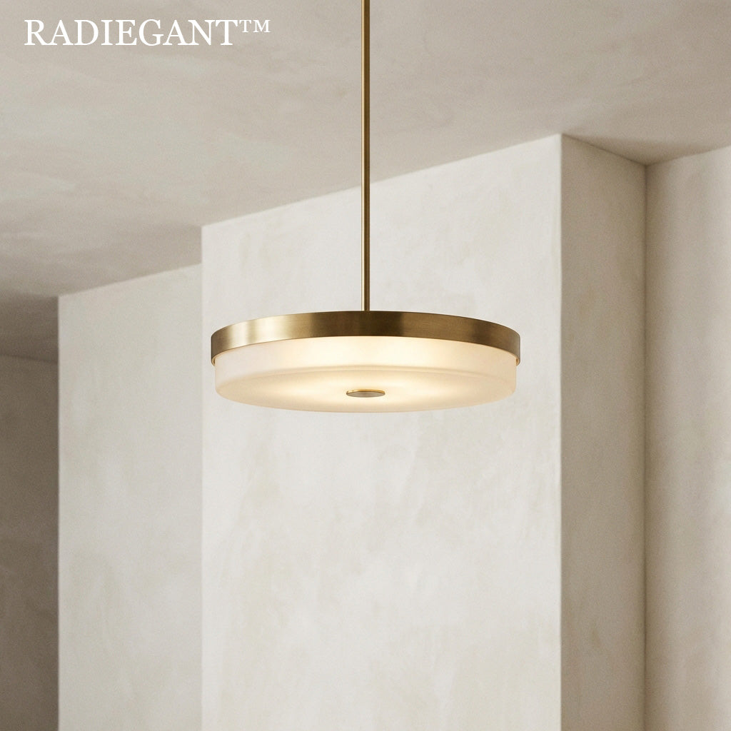 ⭕ Radiegant™ THE ZENITH HALO PENDANT "Atmosphere requires boundaries. By encapsulating a pure, cloud-like wash of light within a fortress of forged brass, we create an artificial horizon—a zenith of uninterrupted calm."